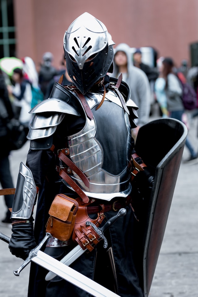 An image of a person in a full suit of armor with a shield and sword.